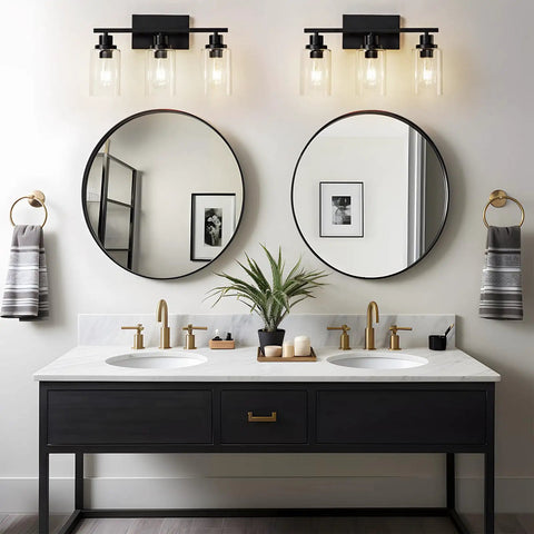 Top Shelf Matte Black Three Light Bathroom Vanity Fixtures With Clear Glass Shades above a modern double sink vanity.