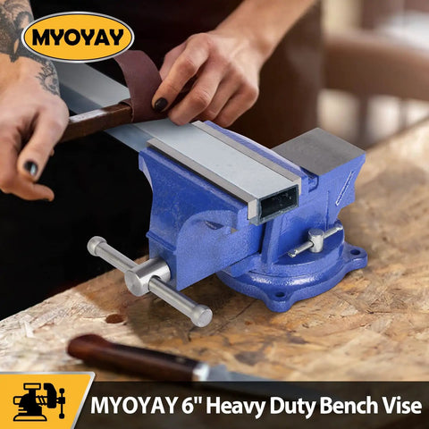 Person using Heavy Duty 6 Inch Bench Vise Clamp with 150mm Jaw on tabletop, showing 360 degree swivel base.