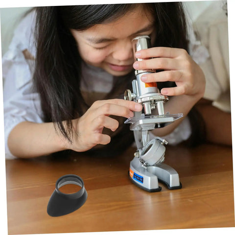 Young girl using microscope with Two Pack Eyepiece Covers Soft Rubber Lens Protectors shown separately