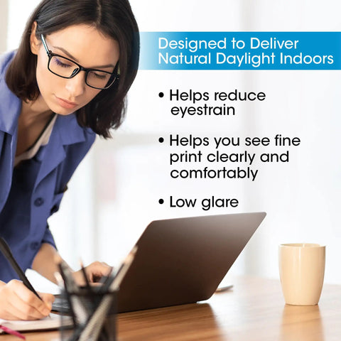 Woman using laptop under Lit 18W EasyView Floor Lamp With 3X Magnifier Attachment in office setting