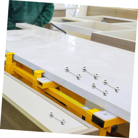 20 Sets Cam Fittings Kit For Furniture Connectors with dowels and fasteners during cabinet assembly with yellow clamp tools