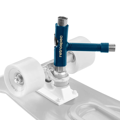 Upkeep Skateboard Multi Tool With Allen Wrench And Phillips Head Driver attached to skateboard trucks and wheels