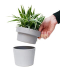 Person holding Hidden Storage Plant Pot Key Hider and Money Stash Safe With Double Concealment Ceramic Flower Pot Secret Compartment