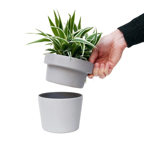 Person holding Hidden Storage Plant Pot Key Hider and Money Stash Safe With Double Concealment Ceramic Flower Pot Secret Compartment