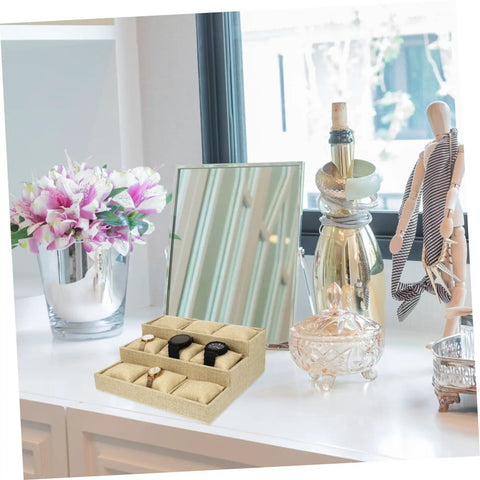 Multi Grid Watch Organizer With Deep Compartments For Desktop And Home, Classic Jewelry Display Tray With Soft Cushion Pads on a desk.