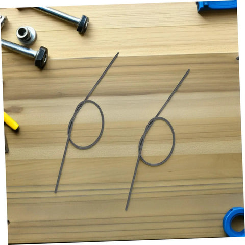 Fresh And Tough Earless Pointed Compression Springs 20 Pack Of 304 Stainless Steel Assortment Kit Perfect For Oil Seal Replacements Industrial Machines And Bag Making Gigs That Rock Hard Like A Boss. Two stainless earless pointed springs on wood table.
