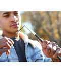 Man using Fiberglass Tent Pole Repair Kit For Quick Fixes On The Trail, Durable Poles With Shock Cord And Ferrules outdoors.
