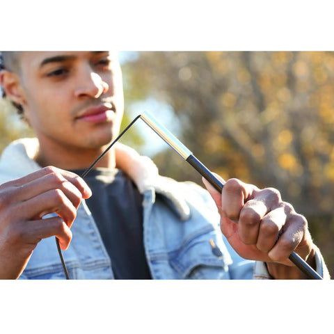 Man using Fiberglass Tent Pole Repair Kit For Quick Fixes On The Trail, Durable Poles With Shock Cord And Ferrules outdoors.