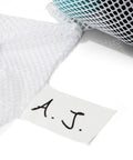 Breathable Mesh Sports Equipment Bag 12x18 Inch with ID tag, close-up of white mesh fabric and handwritten initials "A.J."