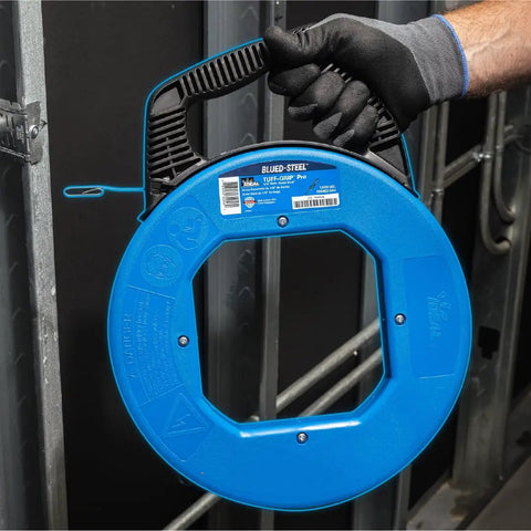 Person holding Pro Grade Blued Steel Fish Tape, 240 Feet Long, One Eighth Inch, 1600 Lb Tensile Strength, Rust Resistant in case
