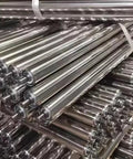 2 Pack Stainless Steel Idler Rollers Heavy Duty Workhorse With Spring Pressed Axle Built Like A Tank For Rock Solid Conveyor Performance Plus Durability stacked in warehouse.