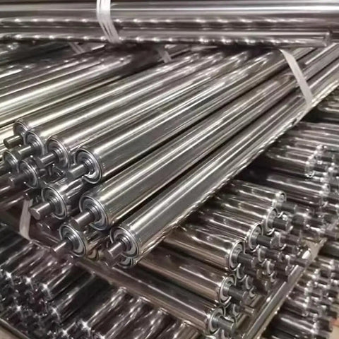 2 Pack Stainless Steel Idler Rollers Heavy Duty Workhorse With Spring Pressed Axle Built Like A Tank For Rock Solid Conveyor Performance Plus Durability stacked in warehouse.