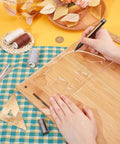 Person using Clear Acrylic Bear Router Template 12X5 Inch Killer Woodworking Guide to trace on wood surface.