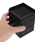 Hand holding 2 Pack Silicone Furniture Pads For Table And Chair Legs Square 3.35 Inch Nonslip Noise Reducing Foot Pads Black
