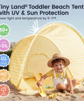 Child playing in sand with Pop Up Baby Beach Tent With 2026 Upgraded UV Protection Lightweight Portable Sun Shelter in yellow stripes