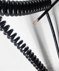 No Worries Two Core Coiled Power Cord With Quick Zip Spiral Extension Cable showing coiled black design and wire details.
