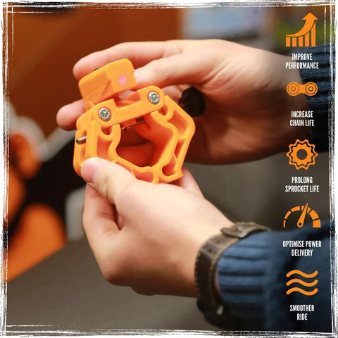 Keep Your Ride Rolling Smooth With This Universal Motorcycle Laser Wheel Alignment Tool being held, showcasing vibrant orange plastic material.