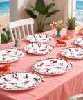 50 Pack Crawfish Boil Disposable Paper Plates Red Grid Oval Heavy Duty Design For Seafood Feasts Backyard Kickbacks Measuring 10X12 Inches Perfect For Summer Bash Parties Where Everyone Will Chow Down displayed on a pink table.
