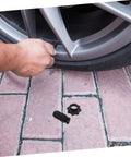 Hand installing Spare Tire Hold Down Bolt For Secure Mounting Heavy Duty Tire Retention Fastener on car wheel