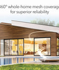 Modern home exterior showcasing Orbi 770 Series Tri Band WiFi 7 Mesh Network System With Router And Two Satellite Extenders coverage.