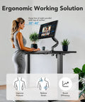 User adjusting Huanuo 70x35 Inch Electric Standing Desk With Three Stage Brushless Motor Black for ergonomic use.