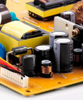 Close-up of circuit board featuring electrolytic capacitor kit from 0.1uF to 1000uF, 15 value assortment, aluminum, for electronics.