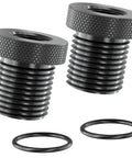 Front view: two black knurled metal thread adapters with rubber washers, 1/2-28 to 3/4-16.