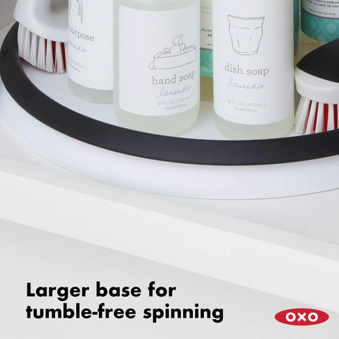 Huge 16 Inch Lazy Susan Turntable With Soft Non Slip Lip And Deep Ledge holding soap bottles, showing large base for stability.