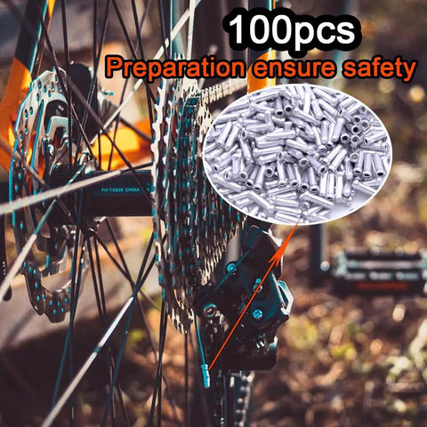 100pcs Alloy Cable End Caps Silver for Road and Mountain Bike Cables End Crimps with bicycle rear wheel in background