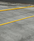 Dead Easy Osha Compliant Industrial Safety Railing With Vivid Yellow Finish And One Piece Welded Base Plates For Quick Plug And Play Surface Mounting, 42in height on a concrete floor.