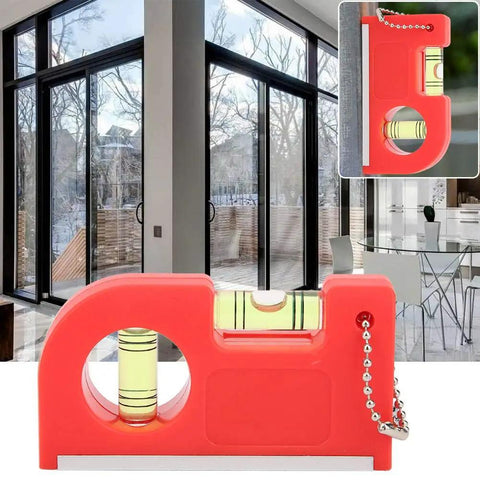 Rcniso Spirit Level Bubble Measuring Instrument for Home 2 Pieces Mini Magnetic Gradient with High Precision for Family Life ABS + TPR + Aluminum Frame in use next to large glass windows.