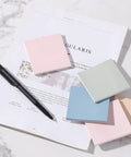 Sticky Notes Bulk Pack 3x3 Inches 12 Pads 600 Sheets Vintage Colors on desk with pen and paper