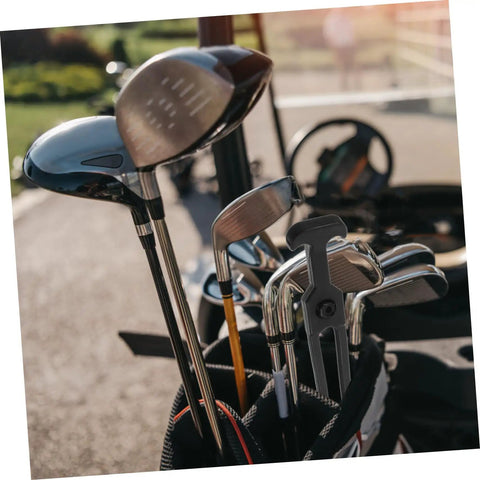 Golf clubs in a bag with blurred golf course and cart in background