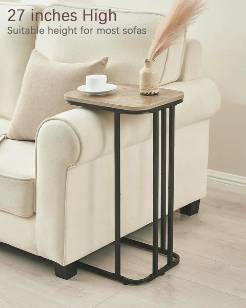 C Shaped End Table For Sofa And Bed, Slim 27 Inch High Side Table That Slides Under Couch, Space Saving And Multi Purpose TV Tray Table For Living Room And Bedroom, Metal Frame In Greige And Black Finish beside a sofa
