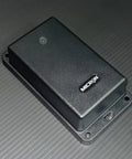 Top Shelf Trailer Gps Tracker With Live Phone Sync No Monthly Fees And Extended Three Year Battery Life For Locking Down Your Gear While You Roll On Any Backroad, compact black device.