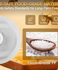 Close-up of Round Bee Top Feeder for Langstroth Hives Four Pack Food Grade PP with plastic pellets in spoon.