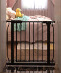Narrow Baby Gate For Tight Doorways And Small Spaces Indoor Safety Gate With No Fuss Auto Close And Walk Through Design Sturdy Metal Pet Gate For Home Use Adjustable 29 To 34 Inches Black Fits Stairs And Door Openings in bedroom