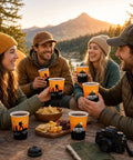 Group enjoying drinks with 50 Pack 9oz Camping And Hiking Themed Disposable Paper Cups For Parties And Outdoor Adventures, No Mess Cleanup.