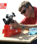 Man using Pistol Sighting In Rest For Handguns, Adjustable Bench Rest With 20 Position Base And Over Molded Rubber Fork Coating