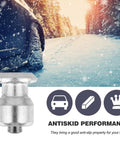 Close-up of Beefy Heavy Duty Spiral Screw Tire Studs Black Ice Crushing Spike Set 50 Count on snowy road for winter traction.
