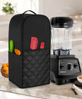 Vitamix 64 Oz Low Profile Blender Cover With Soft Quilted Nylon Interior Black, shown with kitchen accessories on countertop