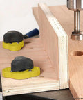 Magswitch MagJig 95 yellow magnetic base clamps with black tops on a wooden jig (two units).