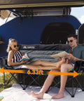 Couple relaxing on a Three Person Folding Camping Chair Couch With Padded Comfort Oversized Outdoor Loveseat Heavy Duty Frame