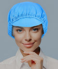 Five Piece Anti Static Work Caps Blue Bouffant Hair Nets Lightweight Mesh Headcaps on a woman smiling, breathable for cleanrooms.
