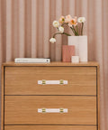 Sleek Crystal Cabinet Pull Handle Set For Cabinets And Drawers, Acrylic And Copper Knob With 64mm Hole Spacing on wooden dresser.