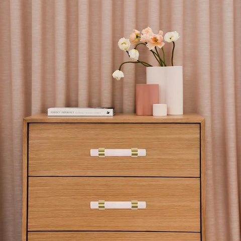 Sleek Crystal Cabinet Pull Handle Set For Cabinets And Drawers, Acrylic And Copper Knob With 64mm Hole Spacing on wooden dresser.