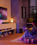 Sub Mini Compact Wireless Subwoofer for Beam and Ray in a stylish living room, enhancing home theater audio with deep bass.