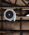 Retractable Air Hose Reel With Three Eighths Inch By 50 Ft Hybrid Polymer Hose Auto Rewind Enclosed Shop Ready Mount Heavy Duty 180 Degree Swivel 300 PSI Pro Grade Commercial Quality Polypropylene Gray installed on ceiling.