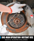 2L One Man Brake Bleeder Kit With 50.7mm Master Cylinder Adapter in use, showing solo bleeding operation on car brake disc.
