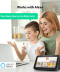 Mother and child using Alexa to view Outdoor And Indoor Security Camera With Spotlight And 1080P WiFi Surveillance on tablet